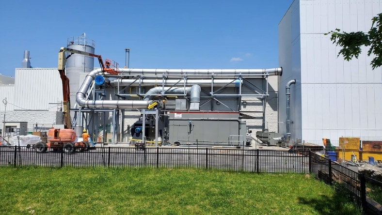 Industrial facility with large ducting, piping and processing units