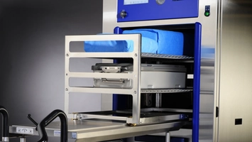 Advanced hospital sterilisation system handling packaged surgical instruments