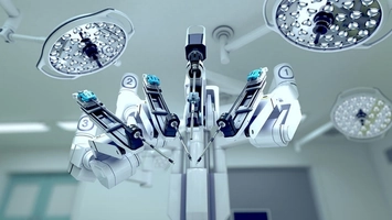 Surgical sterilisation instruments displayed in operating theatre with overhead lights and monitoring systems