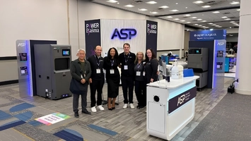 Six ASP staff posing at a trade show stand with STERRAD units and Power Plasma branding in the background